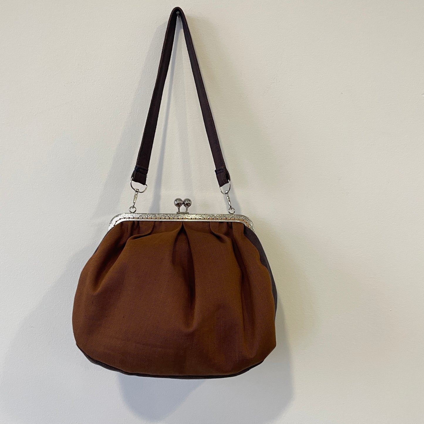 Clutch in denim ruggine