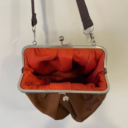 Clutch in denim ruggine